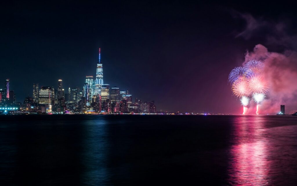 A fireworks display over the waterfront in New York City.