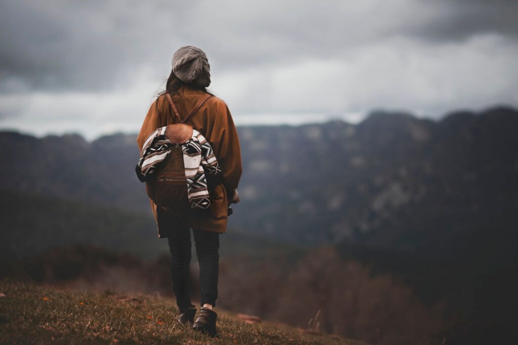 A hiker looking over a mountain top