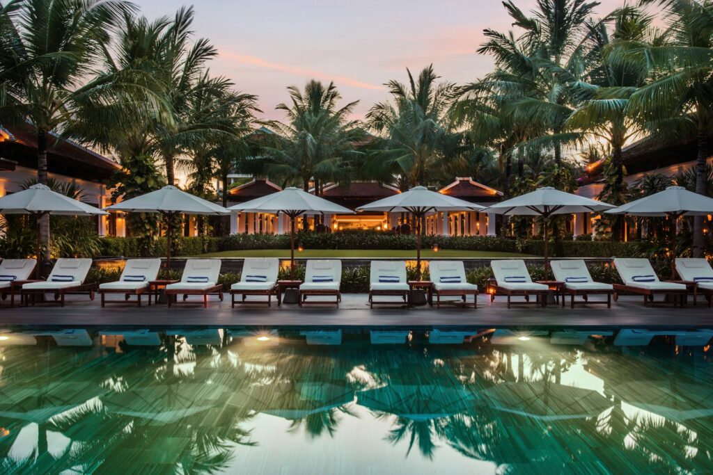 Pool chairs and parasols in a hotel