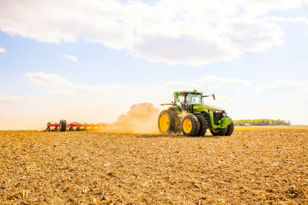 A tractor driving through a field