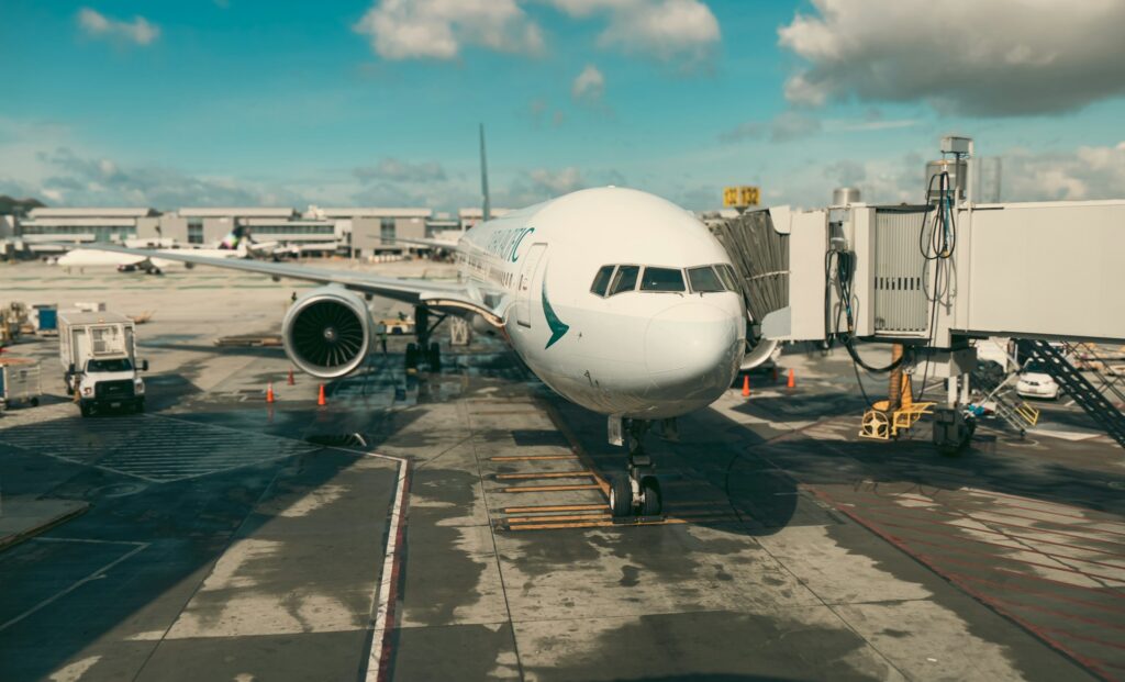 A large jet bridge connected to a plane