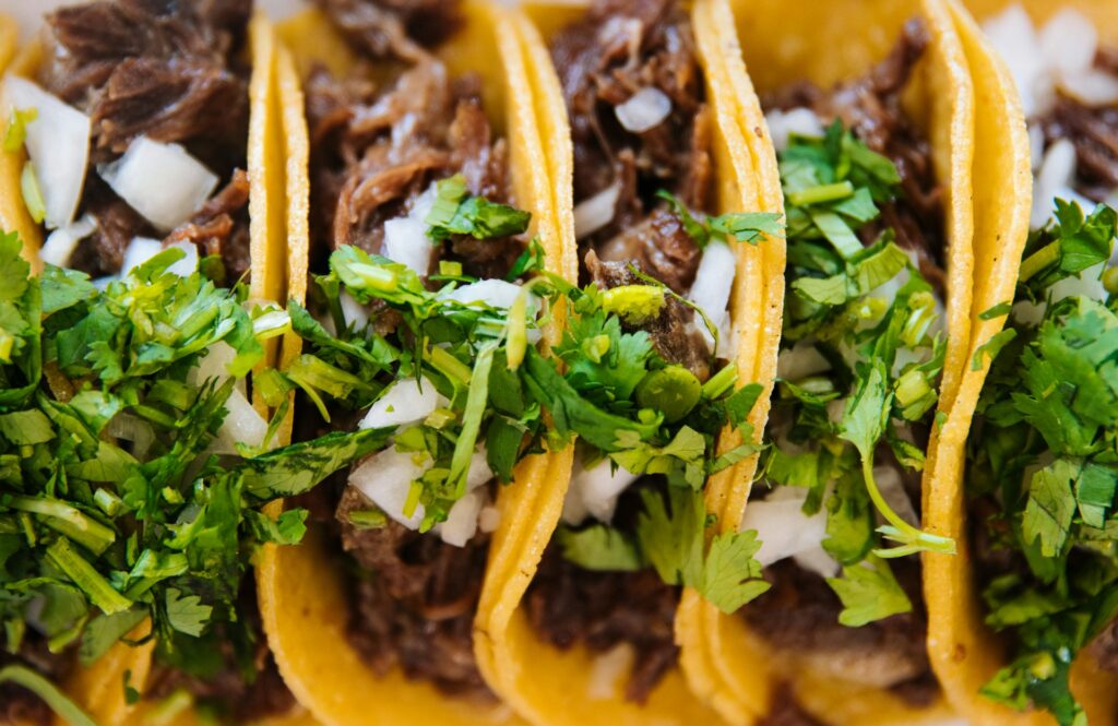 tacos with mince, onions and herbs