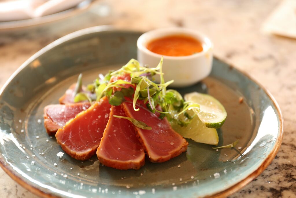 raw meat with spices on green ceramic plate
