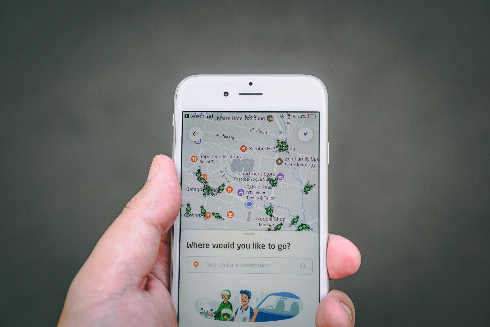 hand holding mobile phone displaying travel map