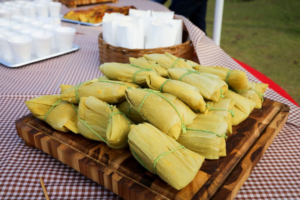 A wooden board full of Tamales