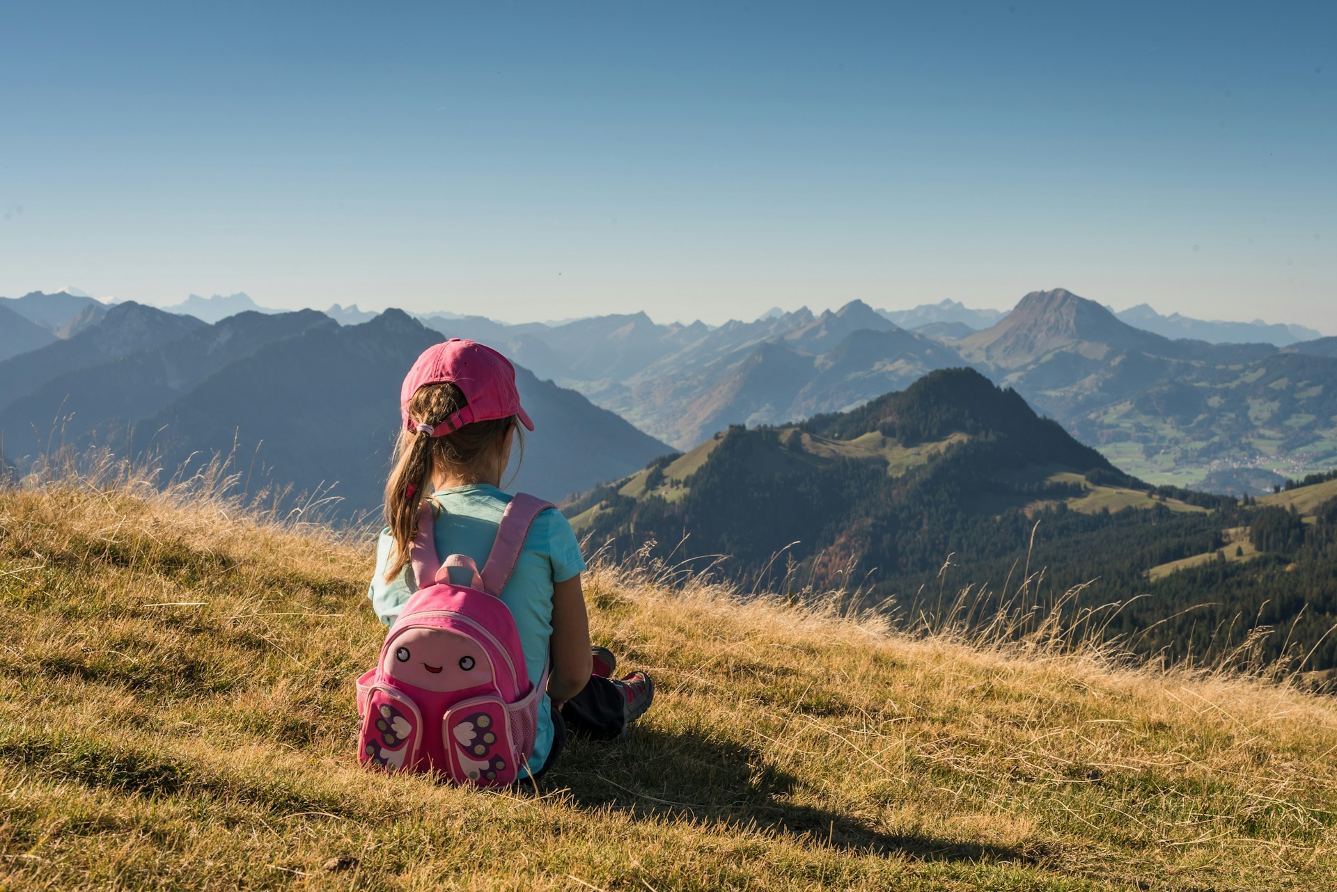 A child sitting on a mountain