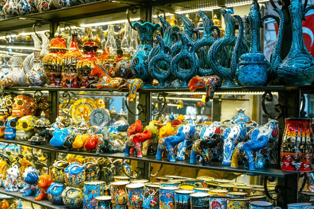 A colorful shopfront at the Grand Bazaar in Istanbul, with shelves of various ceramics.