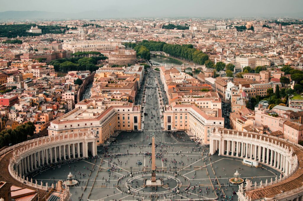 The main square in Vatican City, with several tourists exploring
