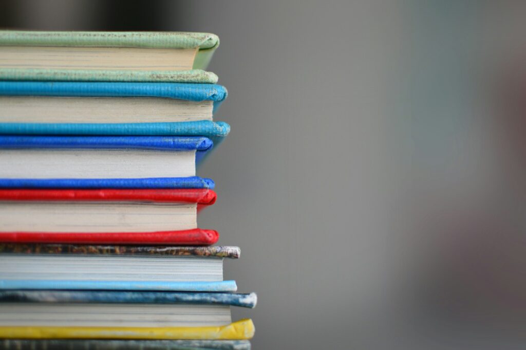 A pile of books stacked on top of each other
