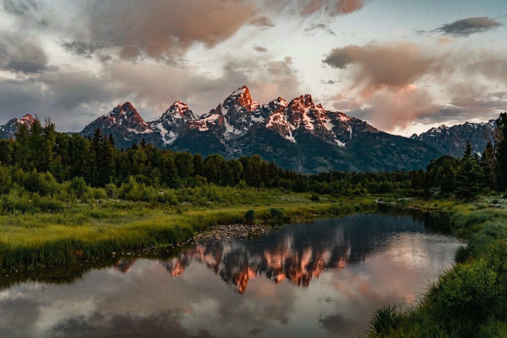 Snowy mountains over a lake